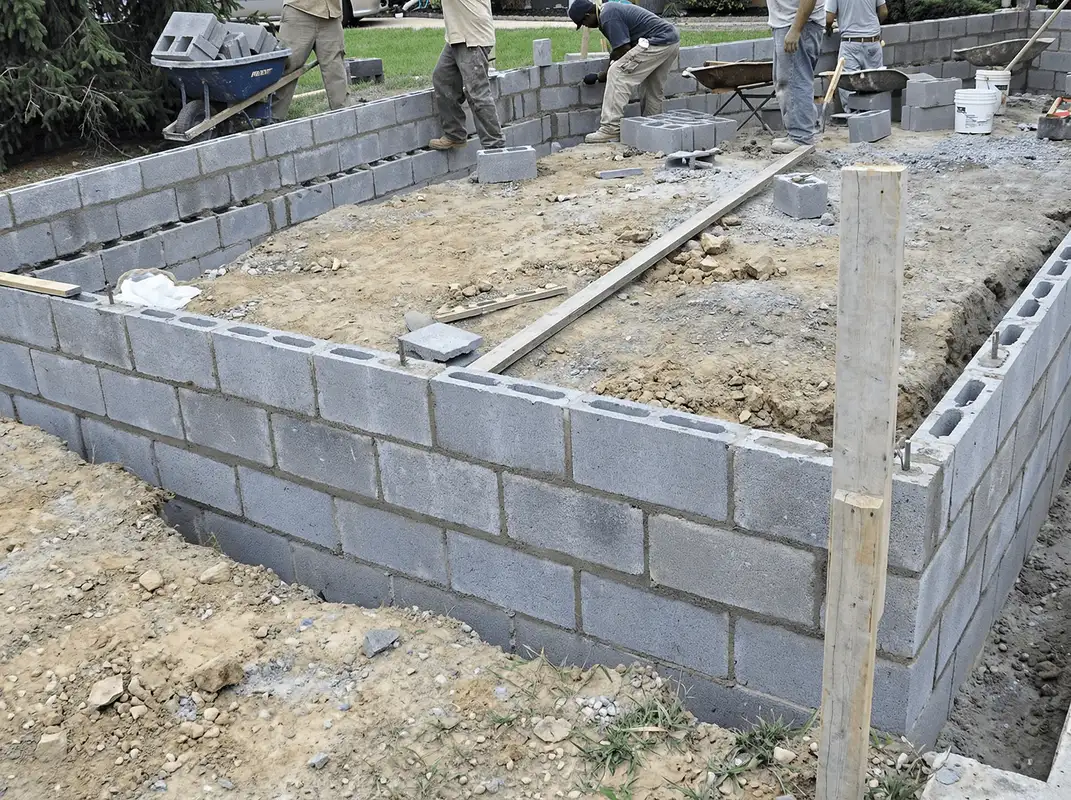 Professionals building a foundation with blocks in Mobile, AL
