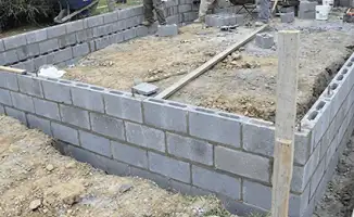 Professionals building a foundation with blocks in Mobile, AL