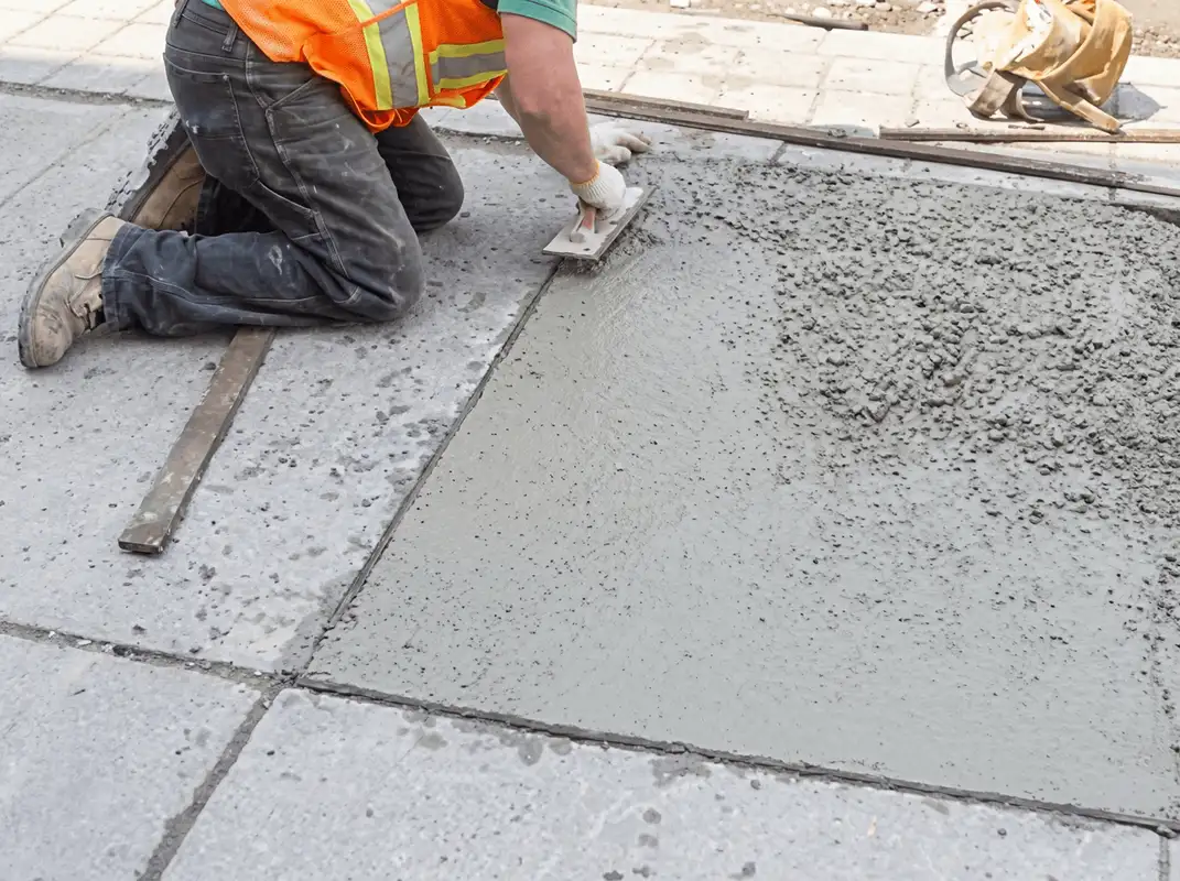 Professional repairing a concrete floor in Mobile, AL