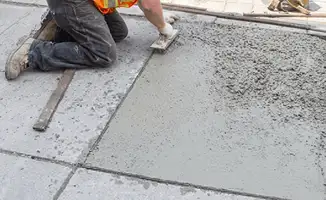 Professional repairing a concrete floor in Mobile, AL