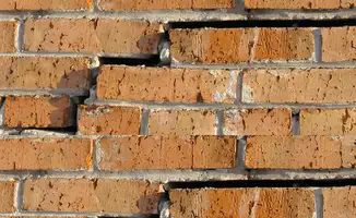 Brick wall with serious structural damage in Mobile, AL